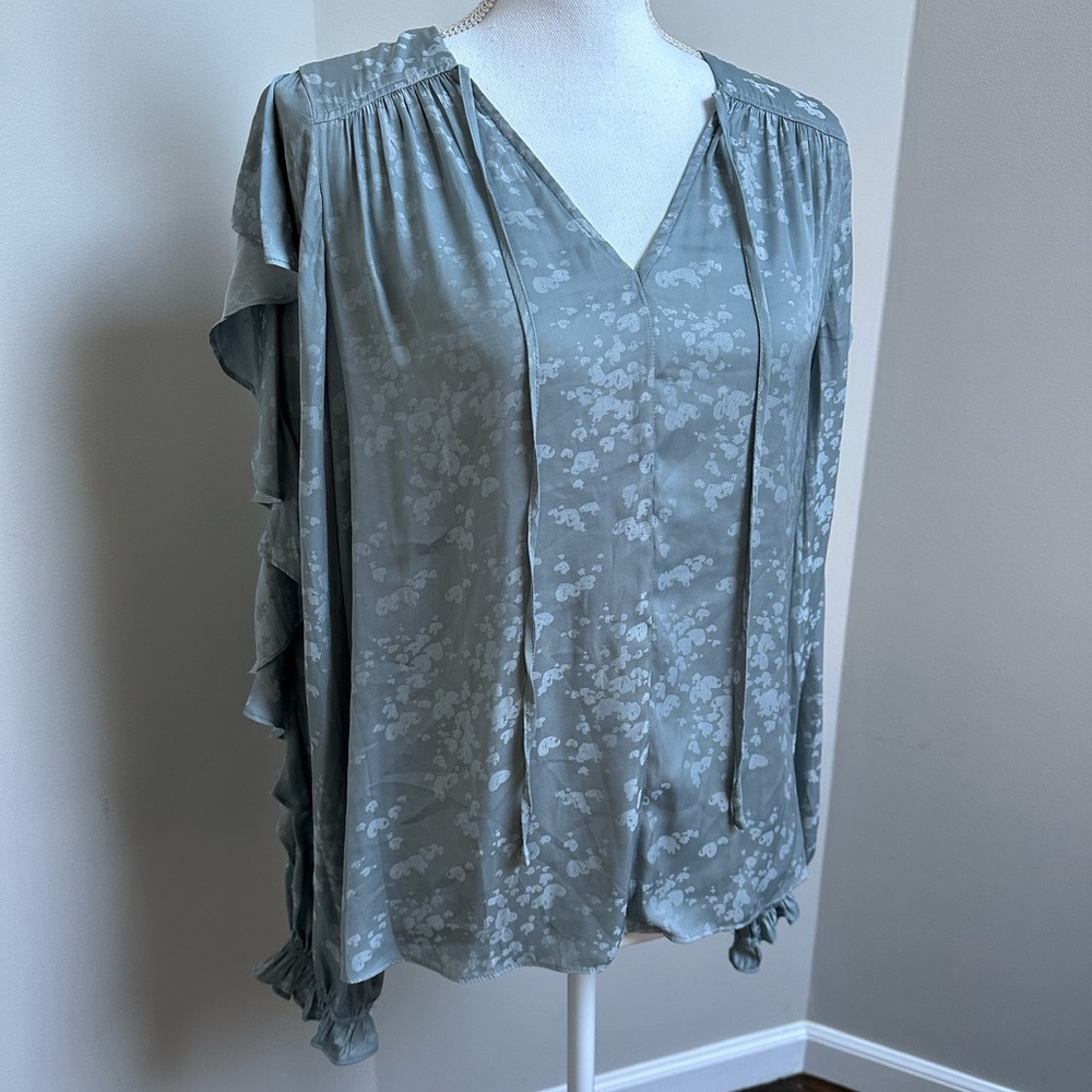 Brand new women's blouse with cool flutter sleeves